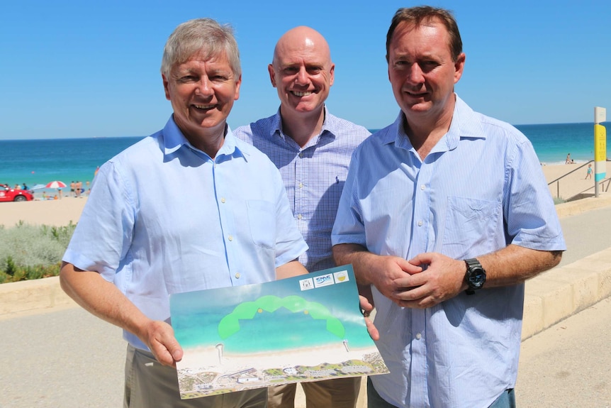 Bill Marmion, Sean L'Estrange and Joe Francis with a picture of a shark deterrent system.