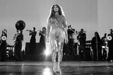 Beyoncé on stage with a band behind her