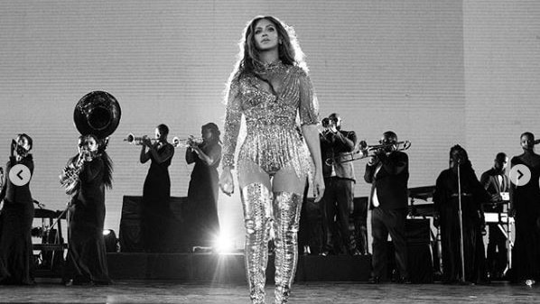Beyoncé on stage with a band behind her