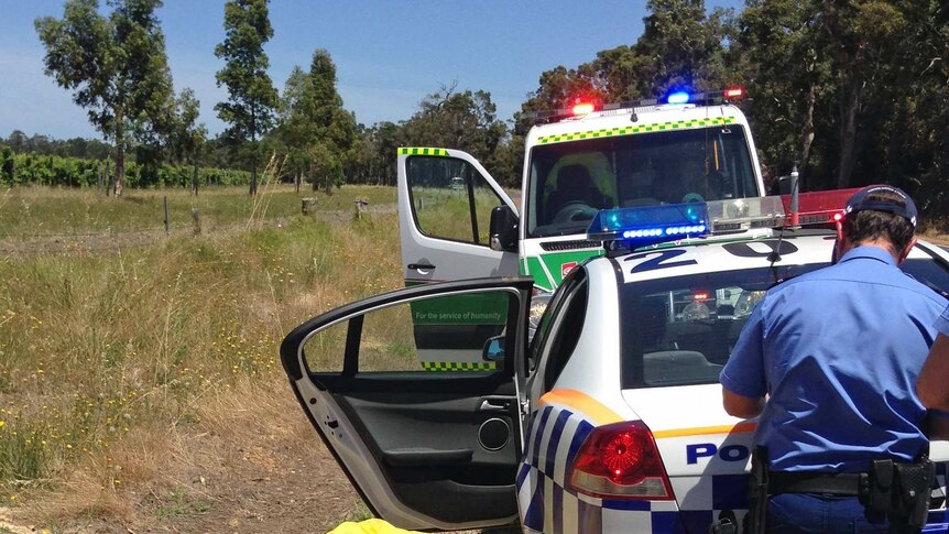 Emergency crews help injured paraglider.