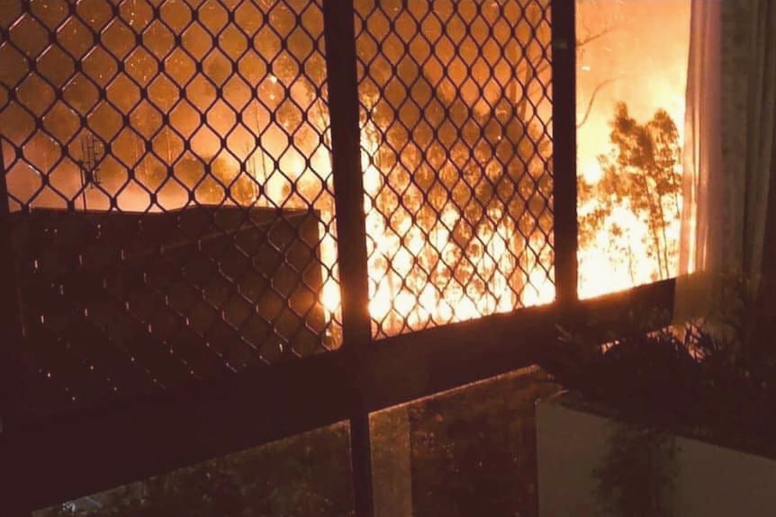 Bushfire approaching Arcare at Peregian Springs as seen through nursing home window.