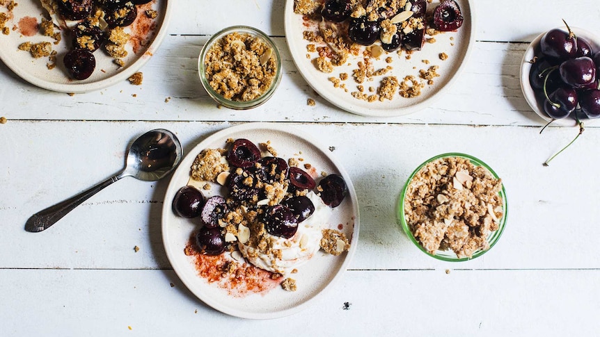 Individual dessert plates with whipped mascarpone, cherries and Anzac crumble for a festive and easy dessert recipe.