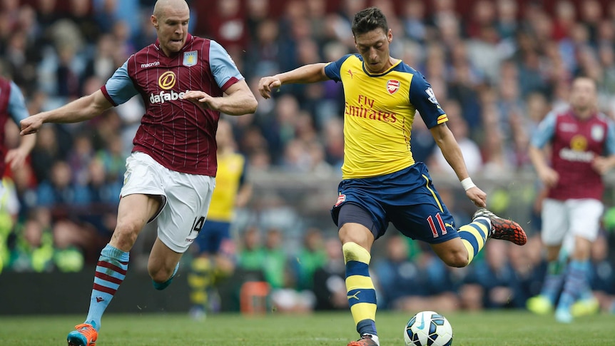 Mesut Ozil winds up against Aston Villa