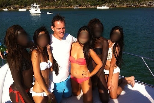 A man with five women on board a boat.