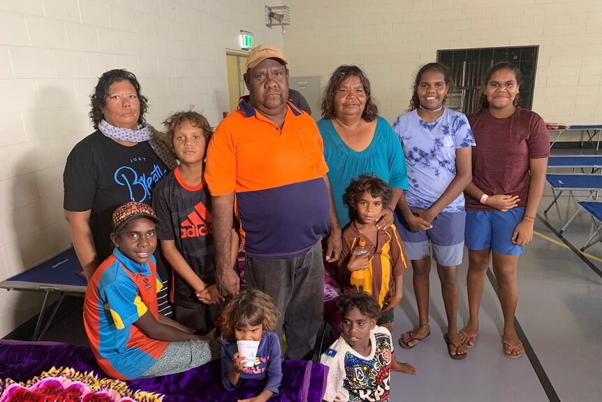 The family stand together in the evacuation centre