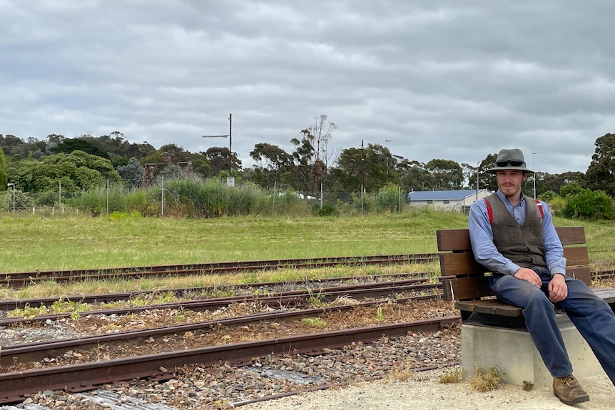 man sits on bench