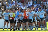 Sharks players look dejected during their round seven loss to the Bulldogs in Gosford.