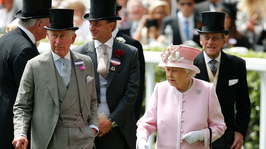 Britain's Queen Elizabeth II, Prince Philip and Prince Charles arrive for the second day of the Royal Ascot in 2013.