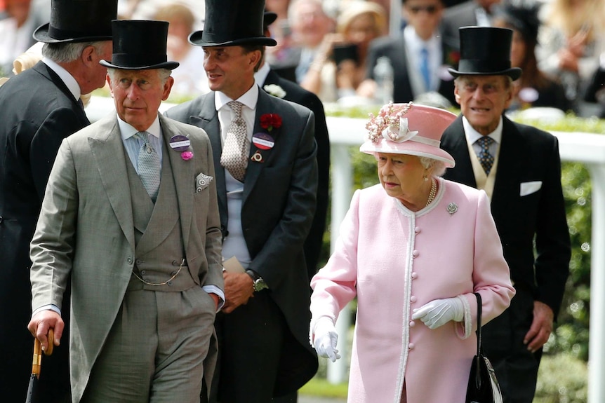 Britain's Queen Elizabeth II, Prince Philip and Prince Charles arrive for the second day of the Royal Ascot in 2013.