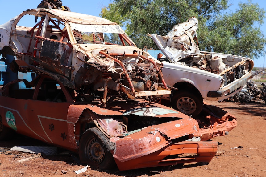 Two car wrecks stacked on top of one another