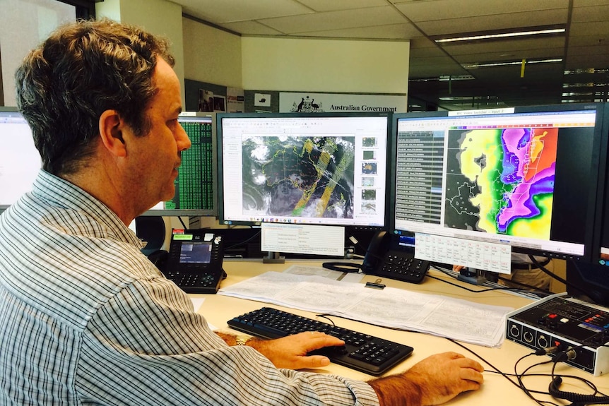 Forecaster Neale Fraser monitors weather models
