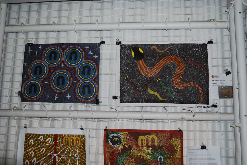 Four Indigenous artworks on display.