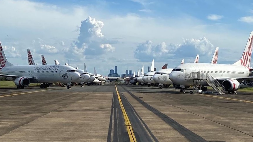 Virgin airlines planes parked on the tarmac at Brisbane Airport