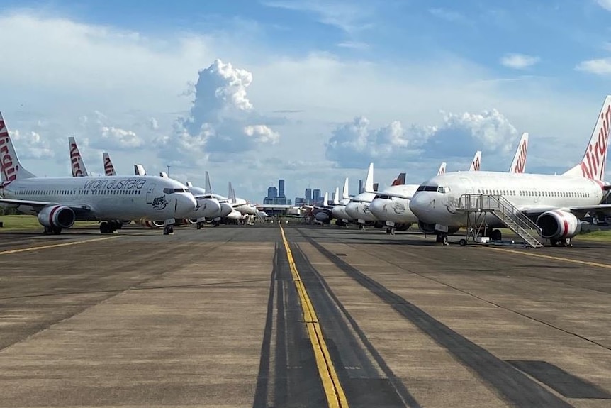 Virgin airlines planes parked on the tarmac at Brisbane Airport