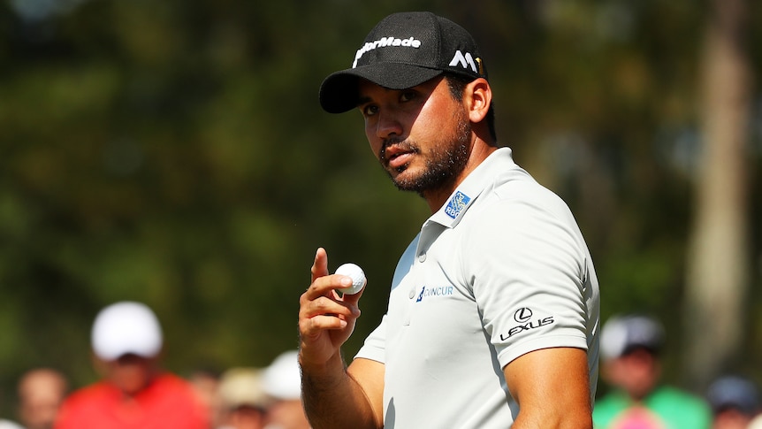 Jason Day points to the crowd during the Players Championship