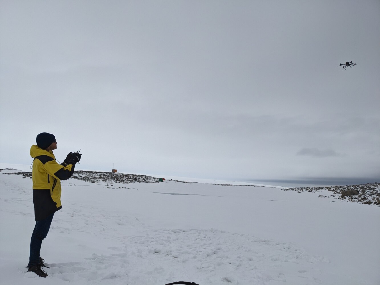 Researcher Juan Sandino flying a drone in Antarctica