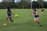 Two Brisbane Girls Grammar School students at touch football training