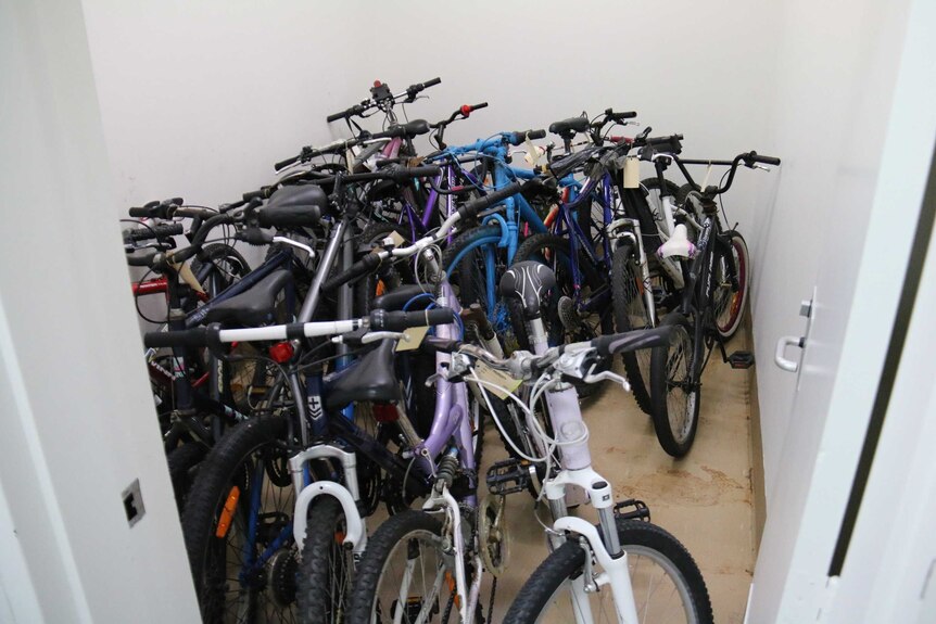 Room full of bikes at QR's lost property department