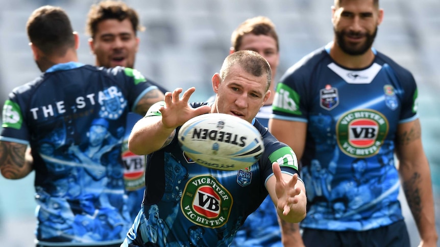 NSW State of Origin captain Paul Gallen (C) takes part in the captain's run at the Olympic stadium.