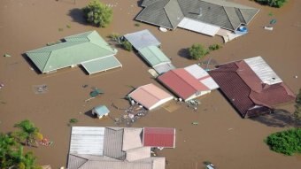 Aerial view of homes covered by floodwaters in Ipswich, west of Brisbane, on January 12, 2011.