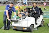 Tariq Sims is carted off the field