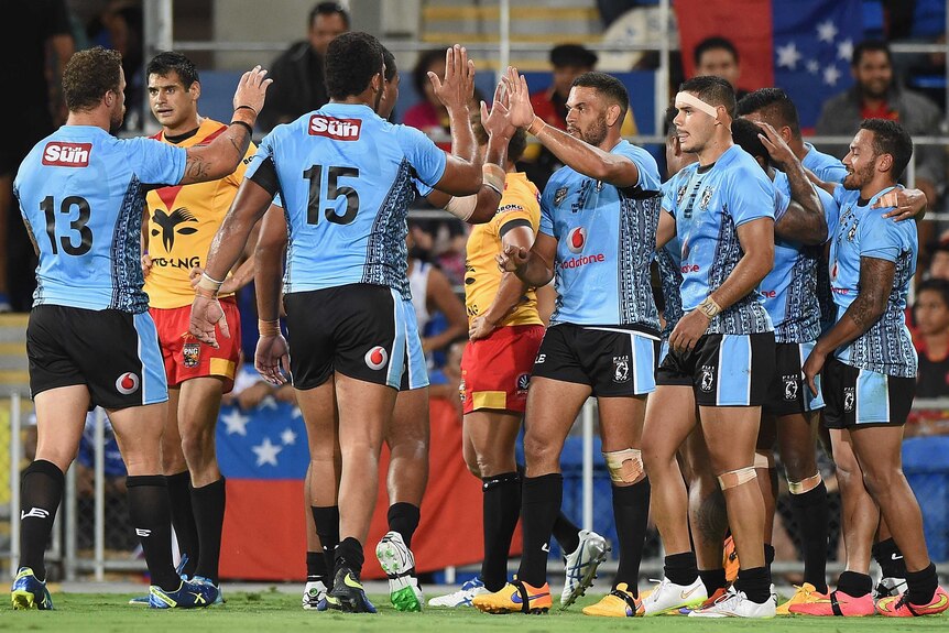 Fiji celebrates one of Marika Koroibete's tries against Papua New Guinea