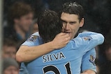Late but great ... Manchester City's Gareth Barry (R) celebrates his injury-time winner over Reading.