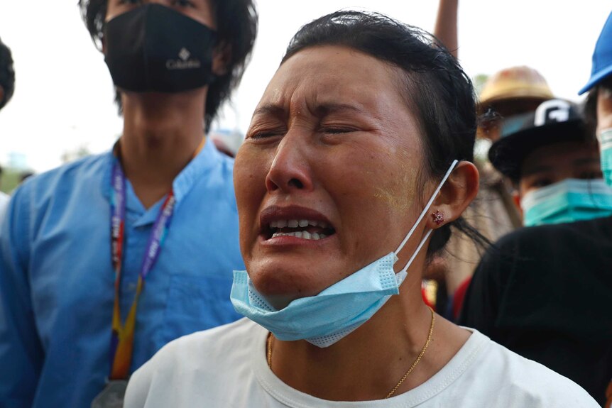 A woman cries during a memorial for killed protester Mya Thwet Thwet Khine