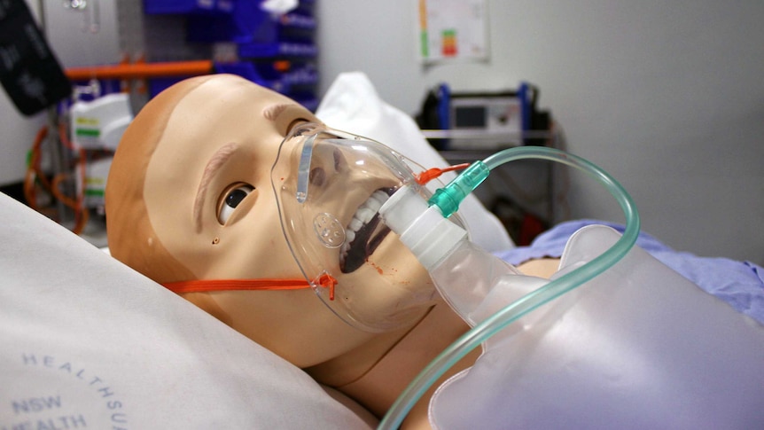 A mannequin wearing a breathing mask