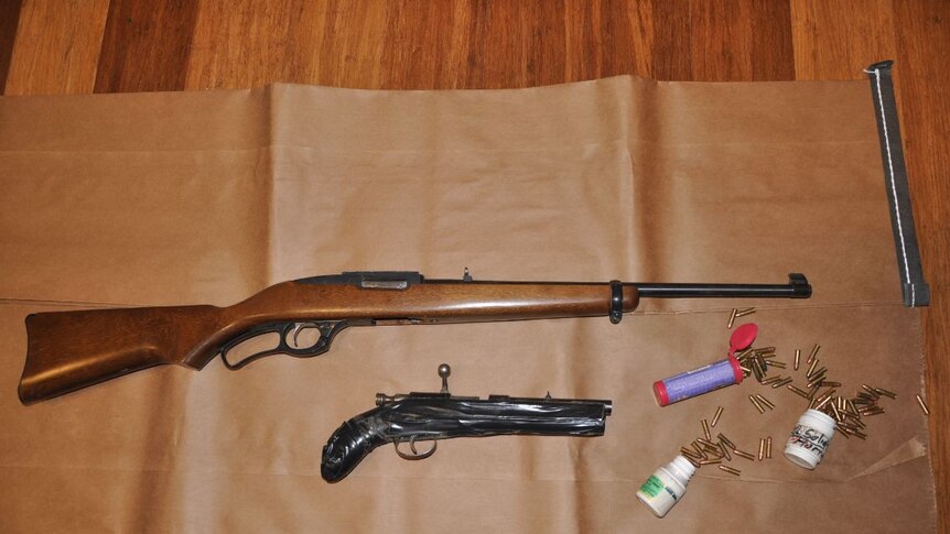 Rifles and ammunition seized at a home in Wanniassa.