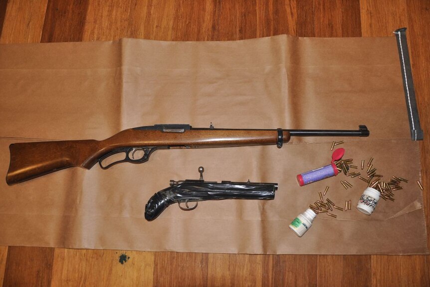 Rifles and ammunition seized at a home in Wanniassa.