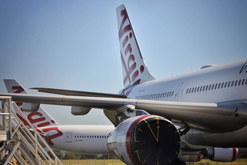 Tails of two Virgin Australia aircraft at Brisbane Airport.