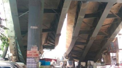 An under view of the bridge collapse showing the falling construction