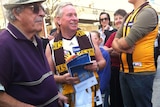 WA Premier Colin Barnett in Hay Street Mall with Hawks guernsey and scarf on