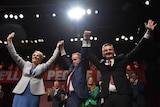 Bill Shorten, Tanya Plibersek and Chris Bowen raise hands in the air at Labor campaign launch in Penrith