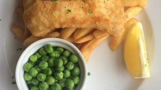 Picture of fish and chips and a bowl of peas 