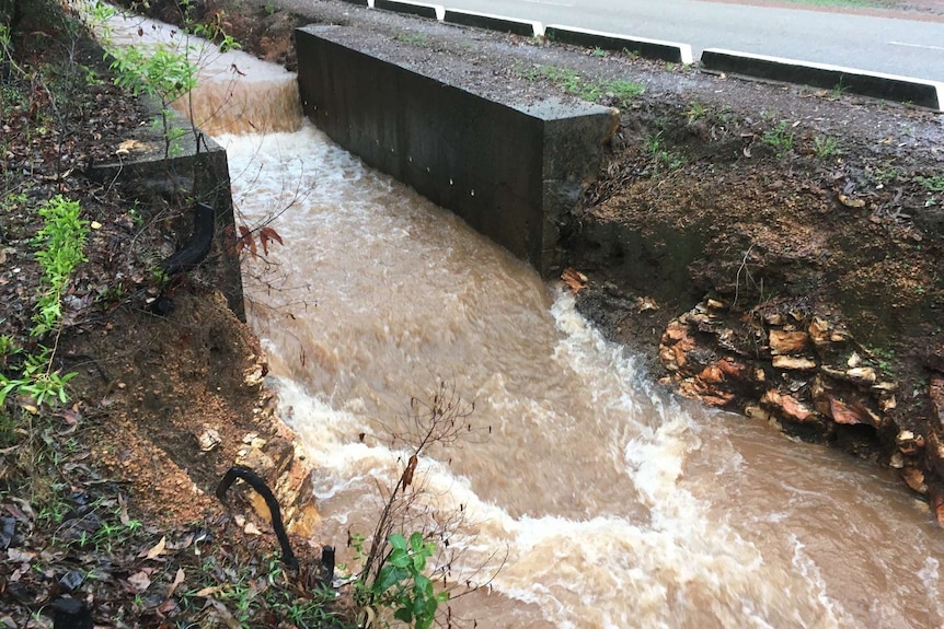 A drain floods at Wagait Beach.