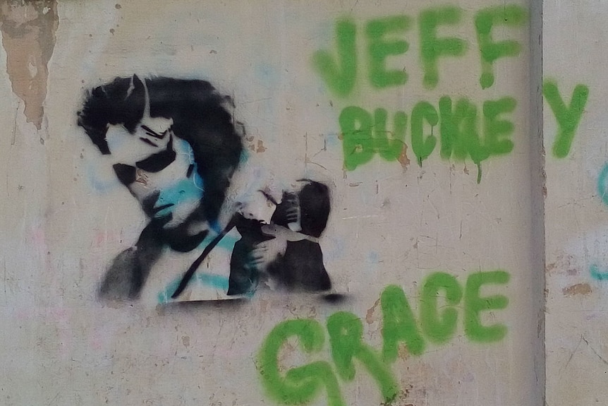 Graffiti depicting singer Jeff Buckley and the name of his album, Grace.