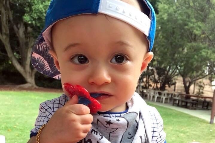 Elijah Huynh wearing a backwards facing baseball cap.