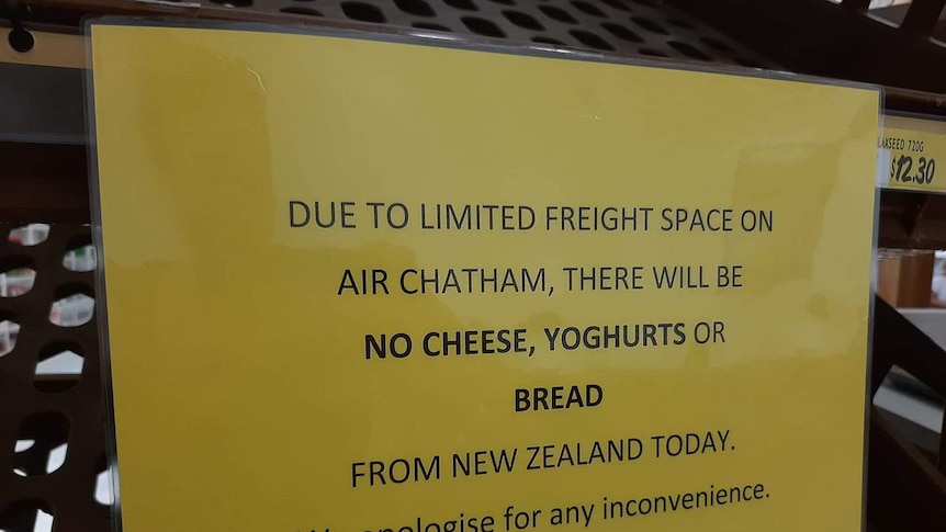 A photo of a sign which says "due to limited freight space on the plane, there will be no cheese, yoghurts or bread today"