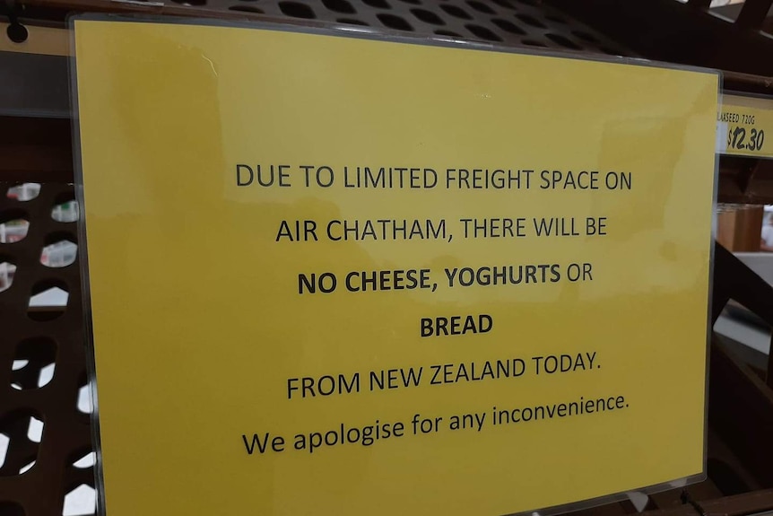 A photo of a sign which says "due to limited freight space on the plane, there will be no cheese, yoghurts or bread today"