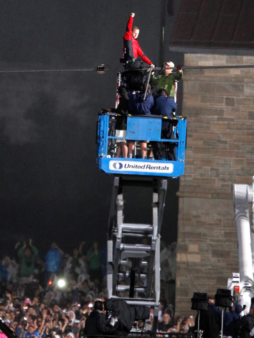 Dream finish ... Wallenda pumps his fist as he reaches the Canadian side of the falls.