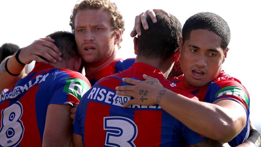 Newcastle Knights celebrate try against Warriors