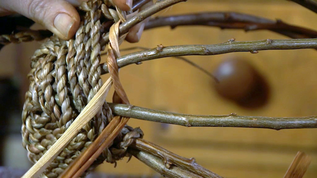 A basket being hand-woven.