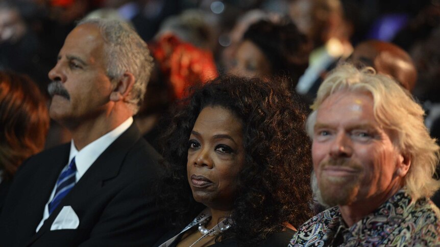 Richard Branson and Oprah Winfrey attend Nelson Mandela's funeral.