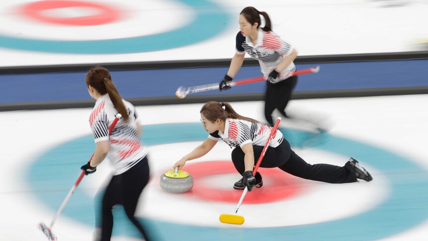 Kim Seonyeong of South Korea throws during their women's curling final.