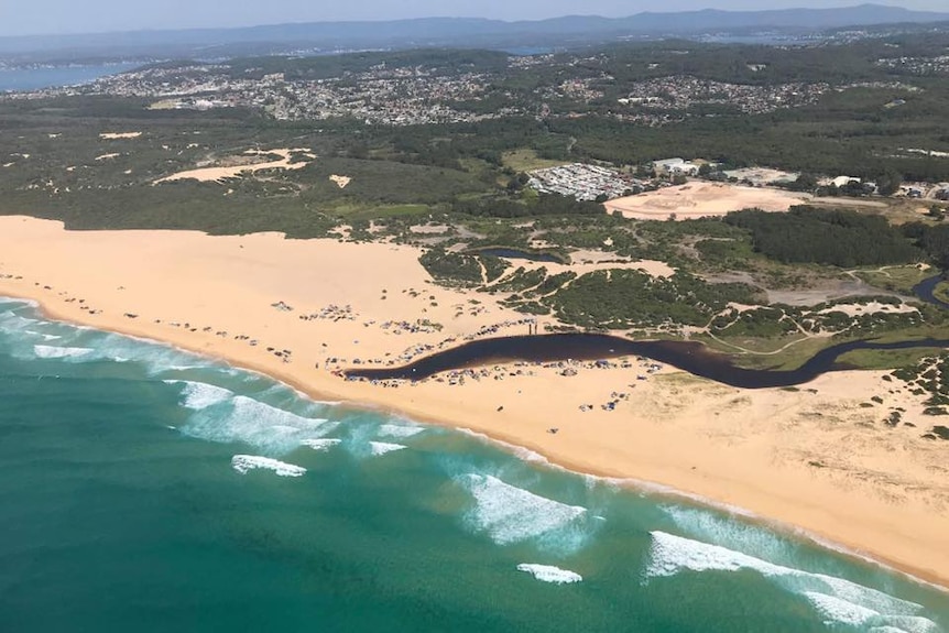 Four wheel drives on Blacksmiths Beach