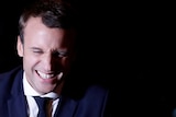 Emmanuel Macron smiles