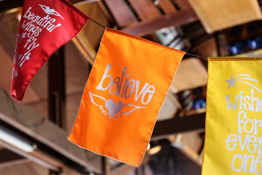 Prayer flag with 'believe' on it