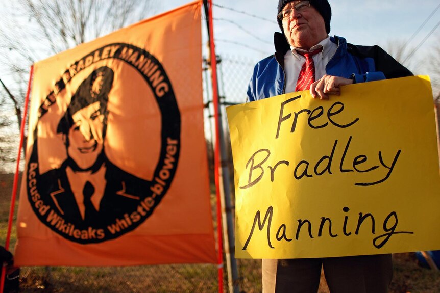 Supporters of Bradley Manning hold a vigil outside the gates of Fort Meade.
